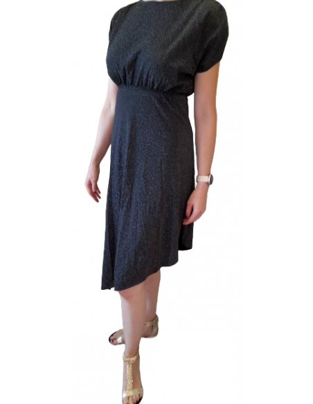 A glittering dance dress for ballroom or tango. With its elegant design, it makes every dancer an attraction on the dance floor